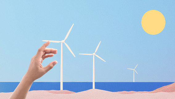 colorful montage of a hand reaching toward a wind turbine and spinning it