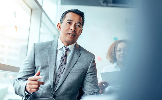 Candid photo of business man talking