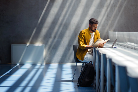 student studying in large hall