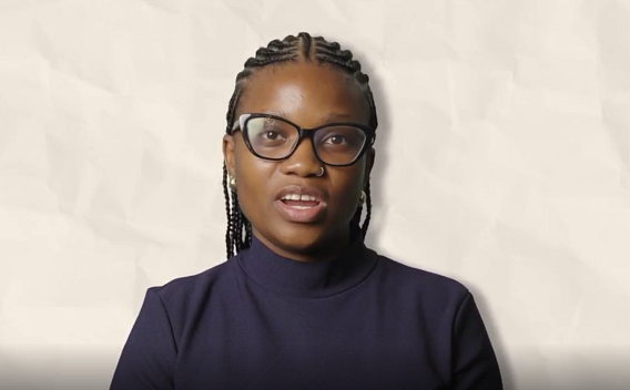 Tshegofatso Sekgwele wearing a black turtle neck top and black glasses