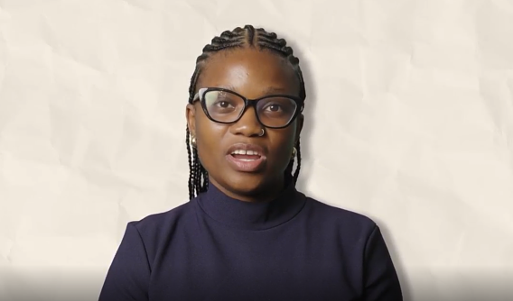 Tshegofatso Sekgwele wearing a black turtle neck top and black glasses